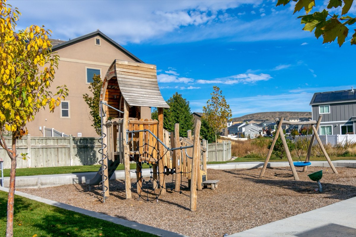 A community playground set among low-rise homes